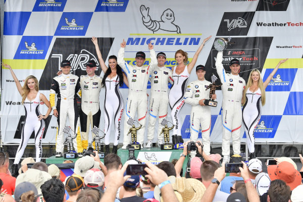 #25 BMW Team RLL BMW M8, GTLM: Alexander Sims, Connor de Phillippi, #3 Corvette Racing Chevrolet Corvette C7.R, GTLM: Antonio Garcia, Jan Magnussen, #24 BMW Team RLL BMW M8 GTLM: John Edwards, Jesse Krohn celebrate the win on the podium