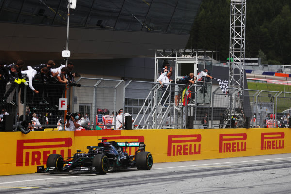 Lewis Hamilton, Mercedes F1 W11 EQ Performance, is greeted by his team after taking victory at the finish Lewis Hamilton, Mercedes F1 W11 EQ Performance, is greeted by his team after taking victory at the finish