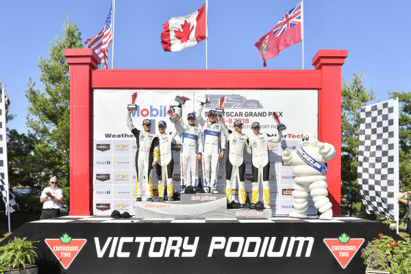 #67 Chip Ganassi Racing Ford GT, GTLM: Ryan Briscoe, Richard Westbrook celebrates the win on the podium with
#3 Corvette Racing Chevrolet Corvette C7.R, GTLM: Antonio Garcia, Jan Magnussen, #4 Corvette Racing Chevrolet Corvette C7.R, GTLM: Oliver Gavin, Tommy Milner, Bib, Bibendum