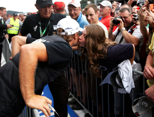 Spa-Francorchamps, Spa, Belgium
25th August 2011.
Nico Rosberg, Mercedes GP W02, gets a cheeky peck from a fan. Portrait. Atmosphere.
World Copyright: Steve Etherington/LAT Photographic
ref: Digital Image SNE26439 Spa-Francorchamps, Spa, Belgium
25th August 2011.
Nico Rosberg, Mercedes GP W02, gets a cheeky peck from a fan. Portrait. Atmosphere.
World Copyright: Steve Etherington/LAT Photographic
ref: Digital Image SNE26439
