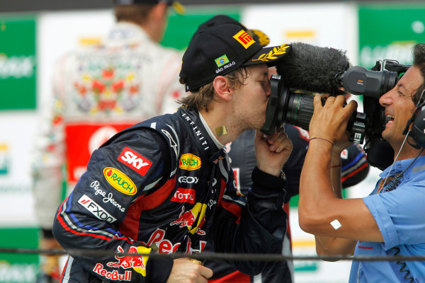 Interlagos, Sao Paulo, Brazil.
27th November 2011.
Sebastian Vettel, Red Bull Racing RB7 Renault gives the camera a kiss after the race.
World Copyright:Andrew Ferraro/LAT Photographic
ref: Digital Image _Q0C6532