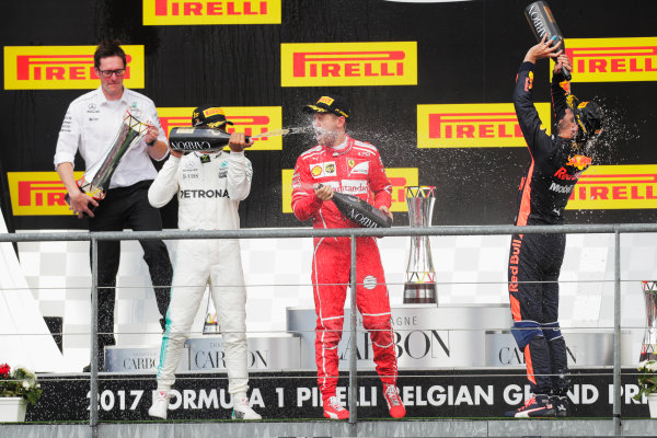 Spa Francorchamps, Belgium. 
Sunday 27 August 2017.
Lewis Hamilton, Mercedes AMG, 1st Position, Sebastian Vettel, Ferrari, 2nd Position, and Daniel Ricciardo, Red Bull Racing, 3rd Position, celebrate with the customary Champagne on the podium.
World Copyright: Zak Mauger/LAT Images 
ref: Digital Image _54I4651