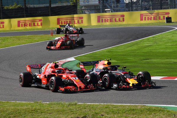 Kimi Raikkonen, Ferrari SF71H and Max Verstappen, Red Bull Racing RB14 battle