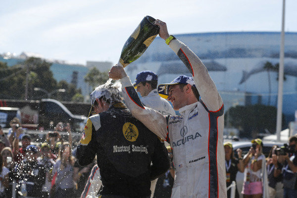 #5 Mustang Sampling Racing Cadillac DPi, DPi: Joao Barbosa, Filipe Albuquerque, #6 Acura Team Penske Acura DPi, DPi: Juan Pablo Montoya, Dane Cameron, #7 Acura Team Penske Acura DPi, DPi: Helio Castroneves, Ricky Taylor celebrate on the podium with champagne