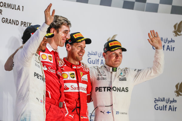 Bahrain International Circuit, Sakhir, Bahrain. 
Sunday 16 April 2017.
Lewis Hamilton, Mercedes AMG, 2nd Position, Matteo Togninalli, Chief Race Engineer, Ferrari, Sebastian Vettel, Ferrari, 1st Position, and Valtteri Bottas, Mercedes AMG, 3rd Position, on the podium.
World Copyright: Charles Coates/LAT Images
ref: Digital Image _27I1025