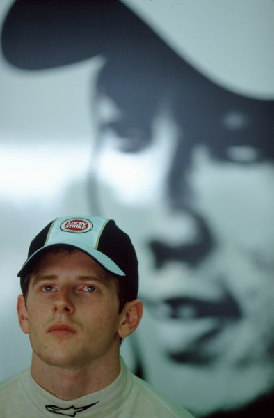 2005 Malaysian Grand Prix. 
Sepang, Kuala Lumpur, Malaysia.
18th - 20th March.
Stand in race driver Anthony Davidson, BAR Honda 007. waits in the pits in front of a picture of the ill Takuma Sato, BAR Honda 007.
World Copyright: Lorenzo Bellanca/LAT Photographic 
ref: 35mm Image only: A07