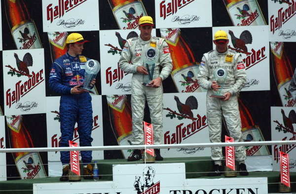 DTM Championship 2002, Round 10 - Hockenheimring, Germany, 6 October 2002 - Podium of the last race of the 2002 season. 1st: Bernd Schneider (GER),Vodafone AMG-Mercedes, centre; 2nd: Mattias Ekstrom (SWE), Team Abt, left; 3rd: Uwe Alzen (GER), Warsteiner AMG-Mercedes, right.
DTM Championship, Rd10, Hockenheim, Germany. 06 October 2002.
DIGITAL IMAGE DTM Championship 2002, Round 10 - Hockenheimring, Germany, 6 October 2002 - Podium of the last race of the 2002 season. 1st: Bernd Schneider (GER),Vodafone AMG-Mercedes, centre; 2nd: Mattias Ekstrom (SWE), Team Abt, left; 3rd: Uwe Alzen (GER), Warsteiner AMG-Mercedes, right.
DTM Championship, Rd10, Hockenheim, Germany. 06 October 2002.
DIGITAL IMAGE