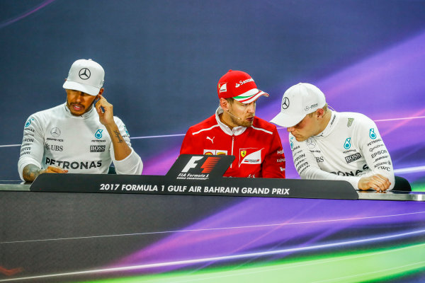 Bahrain International Circuit, Sakhir, Bahrain.
Sunday 16 April 2017.
Lewis Hamilton, Mercedes AMG, 2nd Position, Sebastian Vettel, Ferrari, 1st Position, and Valtteri Bottas, Mercedes AMG, 3rd Position, in the Press Conference.
World Copyright: Sam Bloxham/LAT Images
ref: Digital Image _W6I3362 Bahrain International Circuit, Sakhir, Bahrain.
Sunday 16 April 2017.
Lewis Hamilton, Mercedes AMG, 2nd Position, Sebastian Vettel, Ferrari, 1st Position, and Valtteri Bottas, Mercedes AMG, 3rd Position, in the Press Conference.
World Copyright: Sam Bloxham/LAT Images
ref: Digital Image _W6I3362