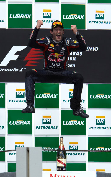 Interlagos, Sao Paulo, Brazil.
27th November 2011.
Mark Webber, Red Bull Racing RB7 Renault, 1st position, celebrates victory. Portrait. Podium. 
World Copyright: Steve Etherington/LAT Photographic
ref: Digital Image SNE28295