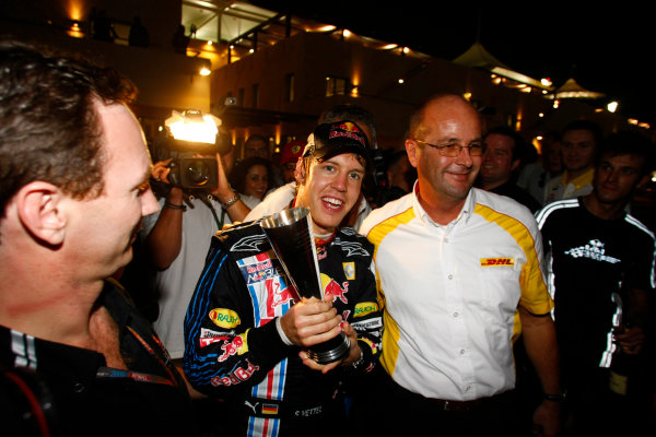 Yas Marina Circuit, Abu Dhabi, United Arab Emirates
1st November 2009.
Sebastian Vettel, Red Bull Racing RB5 Renault, 1st position, Mark Webber, Red Bull Racing RB5 Renault, 2nd position, Christian Horner, Team Principal, Red Bull Racing. and the Red Bull team celebrate their one-two finish. Portrait. 
World Copyright: Charles Coates/LAT Photographic 
ref: Digital Image _26Y3265