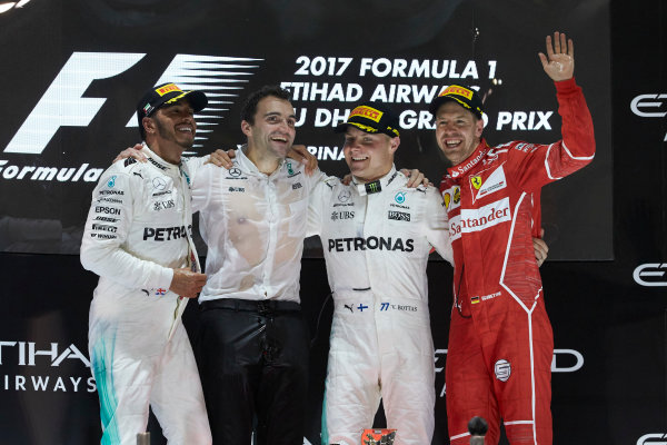 Yas Marina Circuit, Abu Dhabi, United Arab Emirates.
Sunday 26 November 2017.
Lewis Hamilton, Mercedes AMG, 2nd Position, Valtteri Bottas, Mercedes AMG, 1st Position, and Sebastian Vettel, Ferrari, 3rd Position, celebrate on the podium.
World Copyright: Steve Etherington/LAT Images 
ref: Digital Image SNE13349