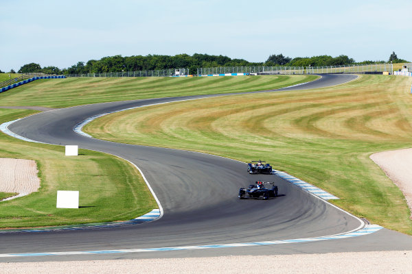 FIA Formula E Season 3 Testing - Day Two.
Donington Park Racecourse, Derby, United Kingdom.
Jose Maria Lopez, DS Virgin Racing, Spark-Citroen, leads Adam Carroll, Jaguar Racing, Spark-Jaguar.
Wednesday 24 August 2016.
Photo: Adam Warner / LAT / FE.
ref: Digital Image _14P2238
