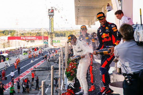 Suzuka Circuit, Japan.
Sunday 8 October 2017.
Max Verstappen, Red Bull, 2nd Position, Lewis Hamilton, Mercedes AMG, 1st Position, and Daniel Ricciardo, Red Bull Racing, 3rd Position, spray Champagne on the podium.
World Copyright: Joe Portlock/LAT Images 
ref: Digital Image _L5R9853