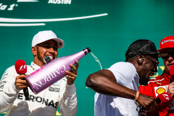 Circuit of the Americas, Austin, Texas, United States of America.
Sunday 22 October 2017.
Lewis Hamilton, Mercedes AMG, sprays the champagne with Usain Bolt on the podium.
World Copyright: Zak Mauger/LAT Images 
ref: Digital Image _X0W7238