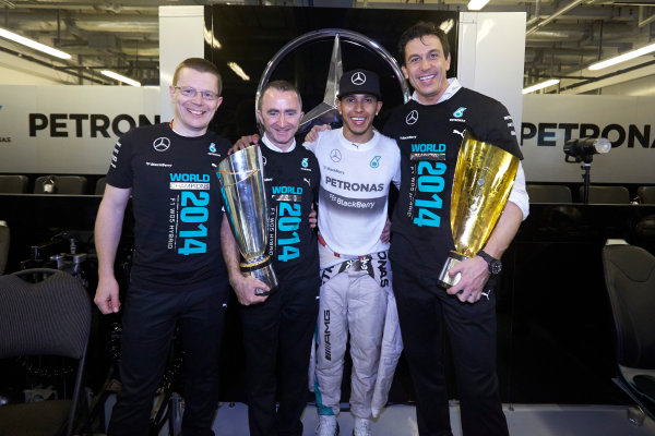 Yas Marina Circuit, Abu Dhabi, United Arab Emirates.
Sunday 23 November 2014. 
Andy Cowell, Paddy Lowe, Lewis Hamilton and Toto Wolff, Mercedes AMG, celebrate championship victory. 
World Copyright: Steve Etherington/LAT Photographic.
ref: Digital Image SNE13537