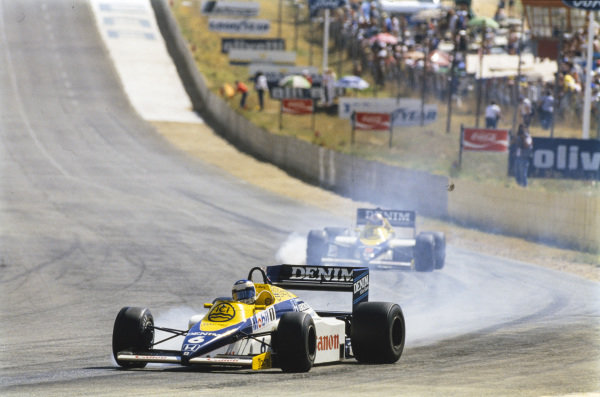 Keke Rosberg, Williams FW10 Honda, locks up on oil ahead of Nigel Mansell, Williams FW10 Honda, who also smokes his front-right tyre. Keke Rosberg, Williams FW10 Honda, locks up on oil ahead of Nigel Mansell, Williams FW10 Honda, who also smokes his front-right tyre.